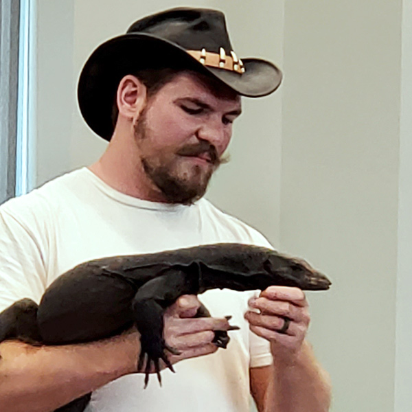 Learning Zoo presenter holding a monitor lizard